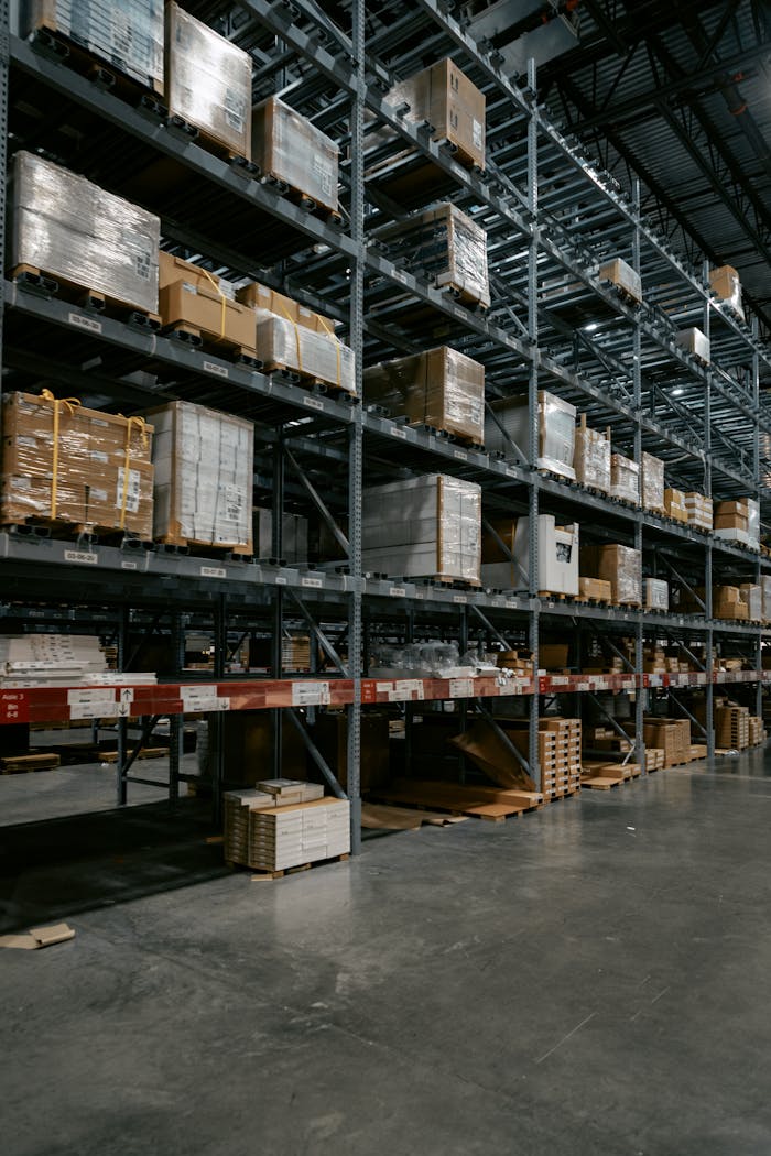 home-hero A well-organized industrial warehouse with stacked shelves and various pallets for efficient storage.