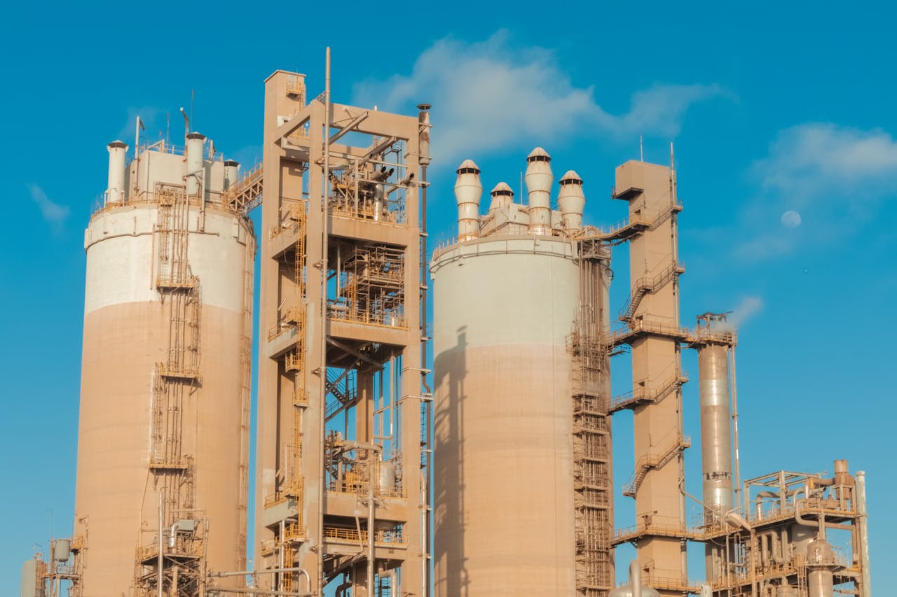 services-03 A view of urea towers at an industrial plant in Libya, captured on a clear day.