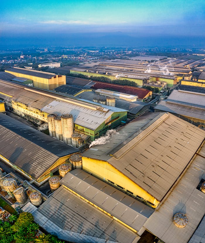 services-06 Aerial view of expansive industrial warehouses in Serang, Banten, showcasing urban infrastructure.